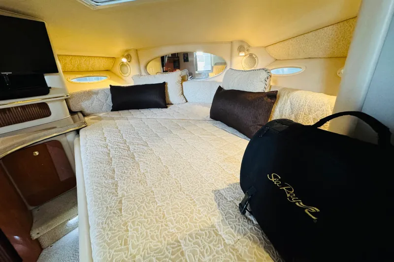 Slide: The Image of Luxurious interior of 2001 Sea Ray Sundancer 310 yacht with cozy bedding and elegant decor. - 36