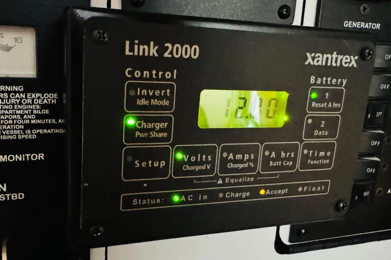 Slide: The Image of Xantrex Link 2000 control panel on 2001 Sea Ray Sundancer 310, displaying battery status. - 46