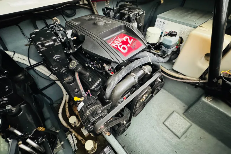 Slide: The Image of Engine compartment of a 2001 Sea Ray Sundancer 310 boat, showcasing mechanical components. - 49