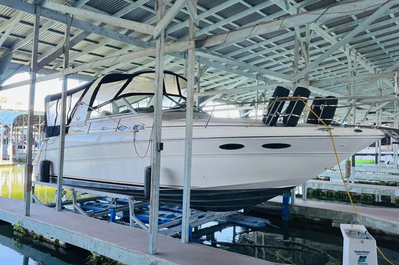 Slide: The Image of 2001 Sea Ray Sundancer 310 yacht docked in a covered marina. - 5