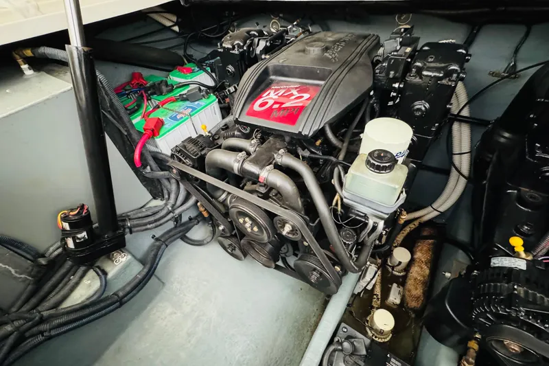 Slide: The Image of Engine compartment of 2001 Sea Ray Sundancer 310, featuring a MerCruiser 6.2L engine. - 50
