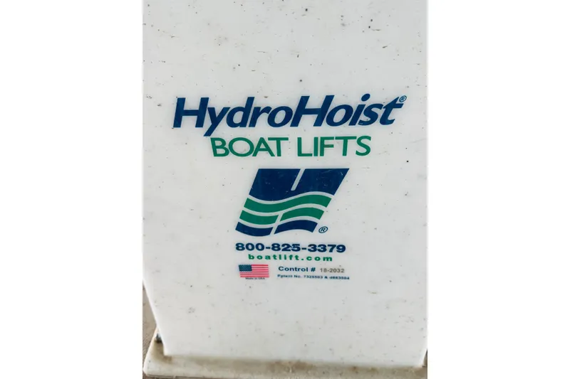 Slide: The Image of HydroHoist Boat Lifts logo with contact details, suitable for Sea Ray Sundancer 310, 2001 model. - 55