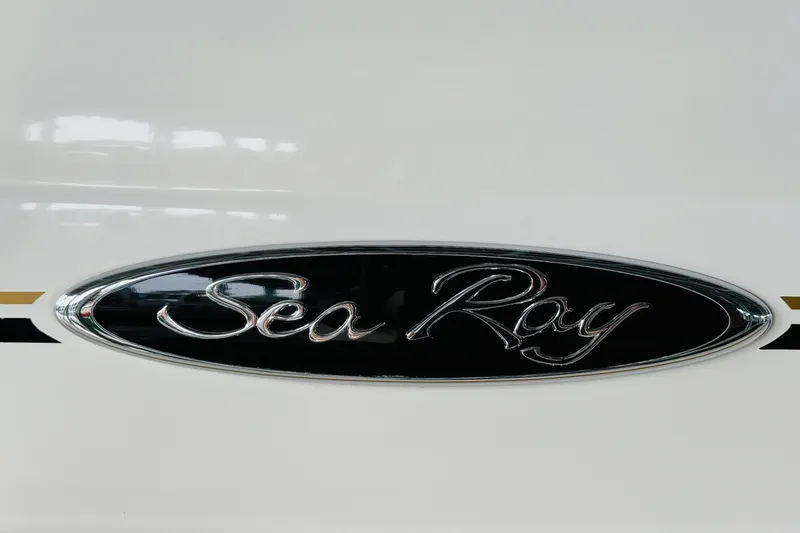 Slide: The Image of Sea Ray Sundancer 310 2001 logo on boat exterior. - 60