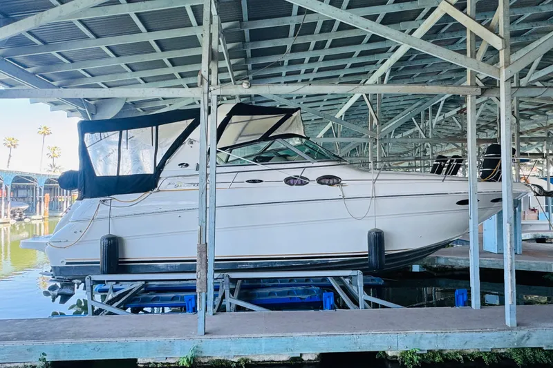 Slide: The Image of 2001 Sea Ray Sundancer 310 yacht docked under covered marina. - 7