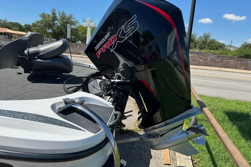 Slide: The Image of 2021 Nitro Z18 boat with Mercury Pro XS outboard motor, parked on a sunny day. - 14