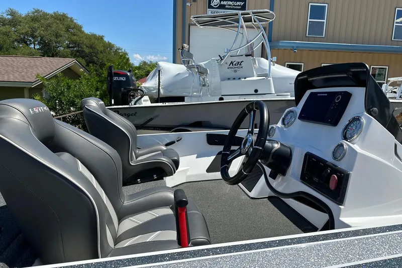 Slide: The Image of 2021 Nitro Z18 boat interior with steering wheel and dual seats. - 6