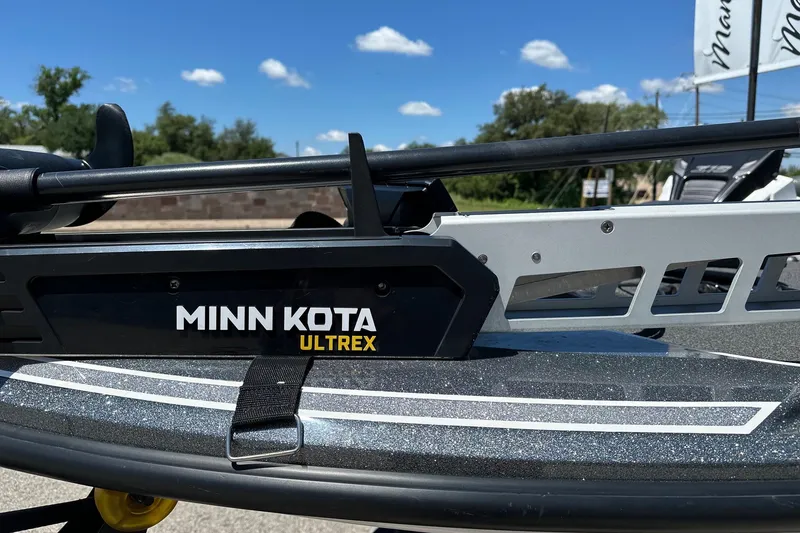 Slide: The Image of Minn Kota Ultrex motor on 2021 Nitro Z18 boat under clear blue sky. - 9