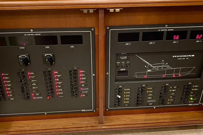 Slide: The Image of Electrical control panels on a 1986 Huckins Sport Fisherman boat. - 33