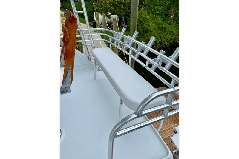Slide: The Image of 1986 Huckins Sport Fisherman boat deck with seating and railing. - 4