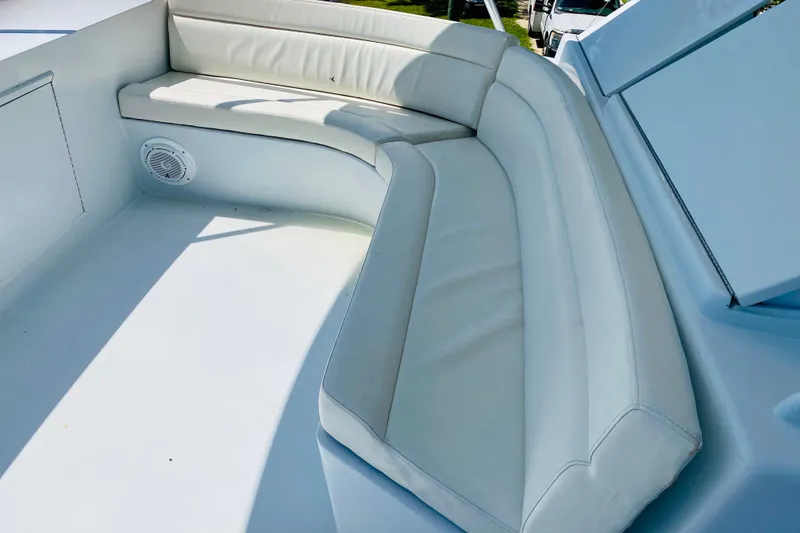 Slide: The Image of White cushioned seating on 1986 Huckins Sport Fisherman boat deck. - 6