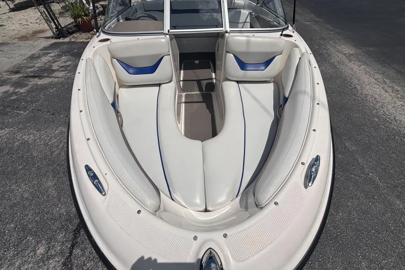 Slide: The Image of 2003 Bayliner 185 Capri boat interior with white and blue seating. - 11