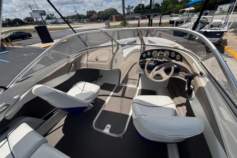 Slide: The Image of 2003 Bayliner 185 Capri boat interior with steering wheel and seating. - 18