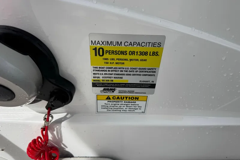 Slide: The Image of Capacity label on 2022 Hurricane SunDeck Sport 205 OB, indicating 10-person or 1308 lbs limit. - 10