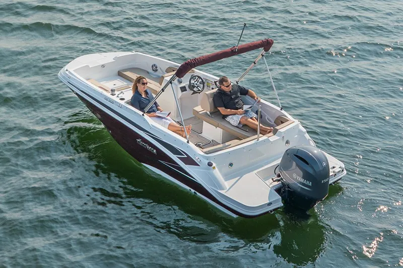 Slide: The Image of Manufacturer Provided Image: 2022 Hurricane SunDeck Sport 205 OB boat cruising on water. - 11