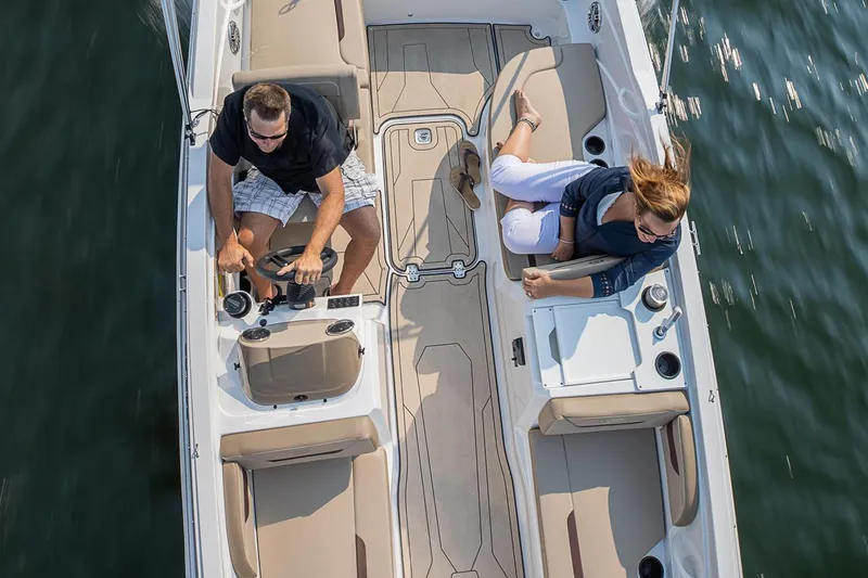 Slide: The Image of Manufacturer Provided Image: 2022 Hurricane SunDeck Sport 205 OB boat with two people onboard. - 13
