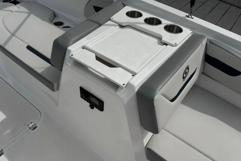 Slide: The Image of 2022 Hurricane SunDeck Sport 205 OB boat interior with cup holders and seating. - 9