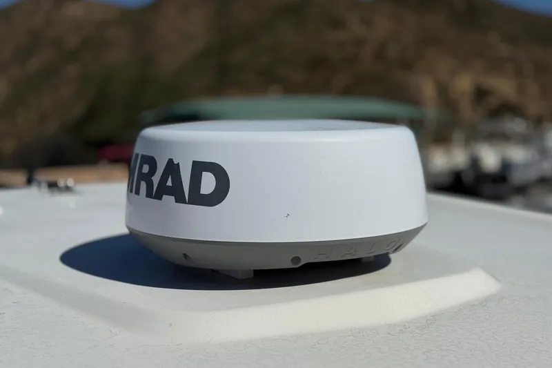 Slide: The Image of Simrad radar on 2022 Robalo R247 Dual Console boat, close-up view. - 23