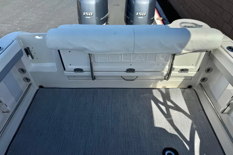 Slide: The Image of 2022 Robalo R247 Dual Console boat interior with Yamaha 150 engines. - 26