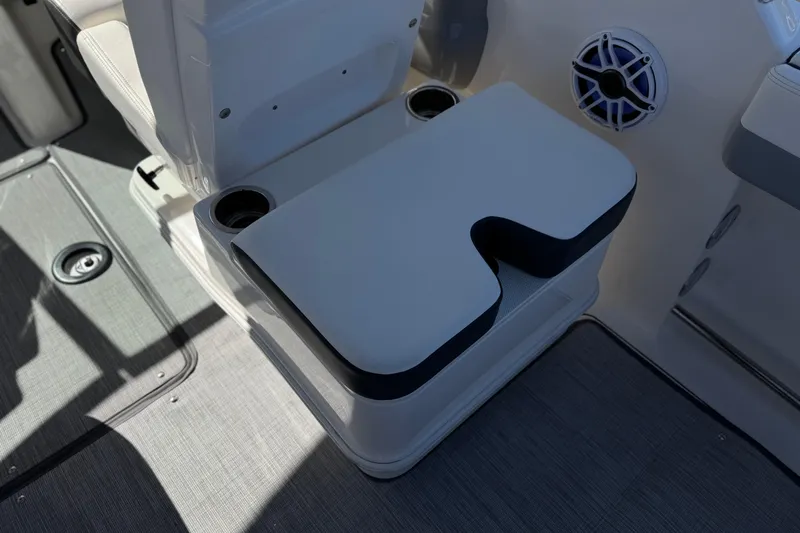 Slide: The Image of 2022 Robalo R247 Dual Console boat seat with cup holders and speaker. - 35