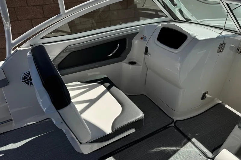 Slide: The Image of 2022 Robalo R247 Dual Console boat interior with seating and dashboard. - 37