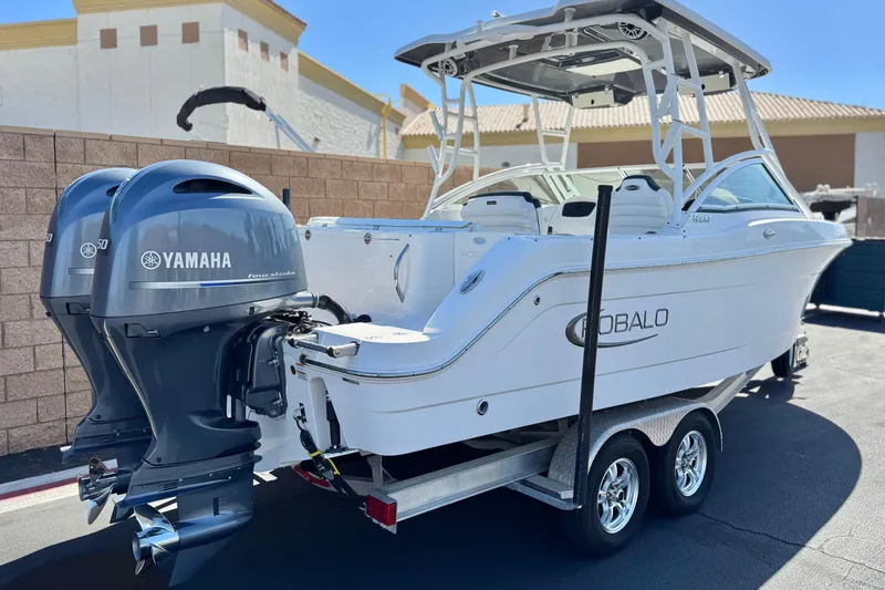 Slide: The Image of 2022 Robalo R247 Dual Console boat with Yamaha engines on a trailer. - 5