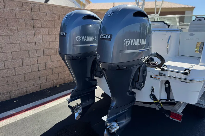 Slide: The Image of 2022 Robalo R247 Dual Console with twin Yamaha 150 outboard engines. - 6