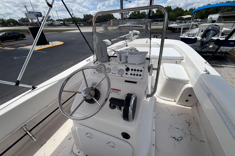 Slide: The Image of 2008 Sundance B18CC boat interior with steering wheel and control panel. - 16