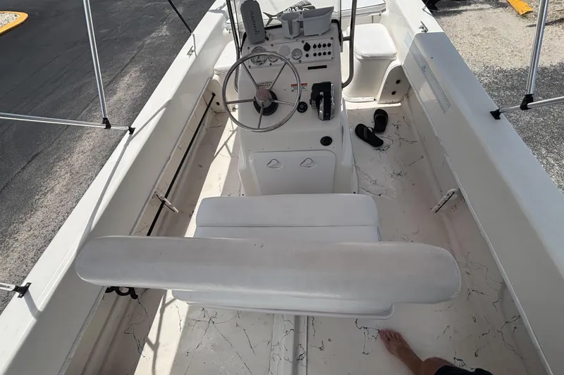 Slide: The Image of 2008 Sundance B18CC boat interior with steering console and seating. - 24