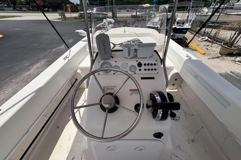 Slide: The Image of 2008 Sundance B18CC boat console with steering wheel and Garmin navigation system. - 25