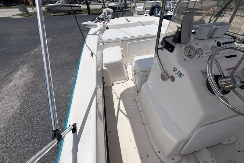 Slide: The Image of 2008 Sundance B18CC boat interior with steering console and seating. - 27