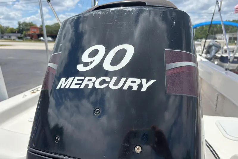 Slide: The Image of Outboard motor with "90 Mercury" branding on a 2008 Sundance B18CC boat. - 30
