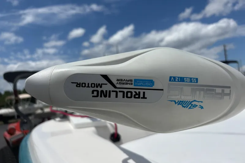 Slide: The Image of Close-up of a trolling motor on a 2008 Sundance B18CC boat under a blue sky. - 32