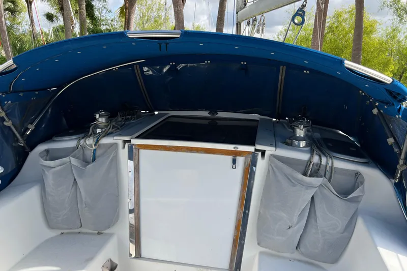 Slide: The Image of Cockpit of 1999 Catalina 36 MkII sailboat with blue canopy and storage pockets. - 2