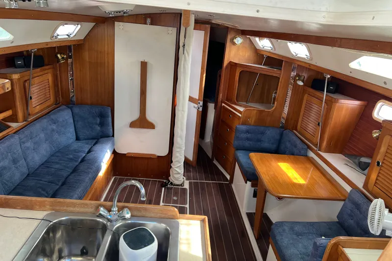 Slide: The Image of Interior of a 1999 Catalina 36 MkII sailboat with wood finish and blue upholstery. - 4