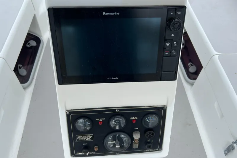 Slide: The Image of Control panel of a 2008 Catalina 470 sailboat with Raymarine display and gauges. - 10