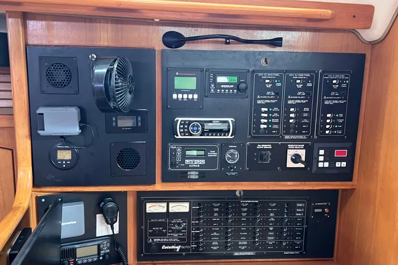 Slide: The Image of Electrical control panel of a 2008 Catalina 470 yacht with various switches and displays. - 21