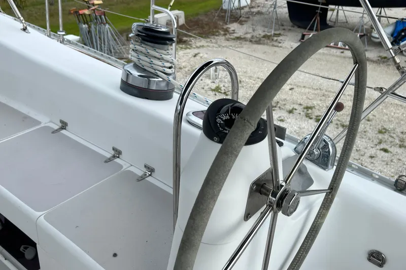Slide: The Image of Steering wheel and winch on a 2008 Catalina 470 sailboat deck. - 9