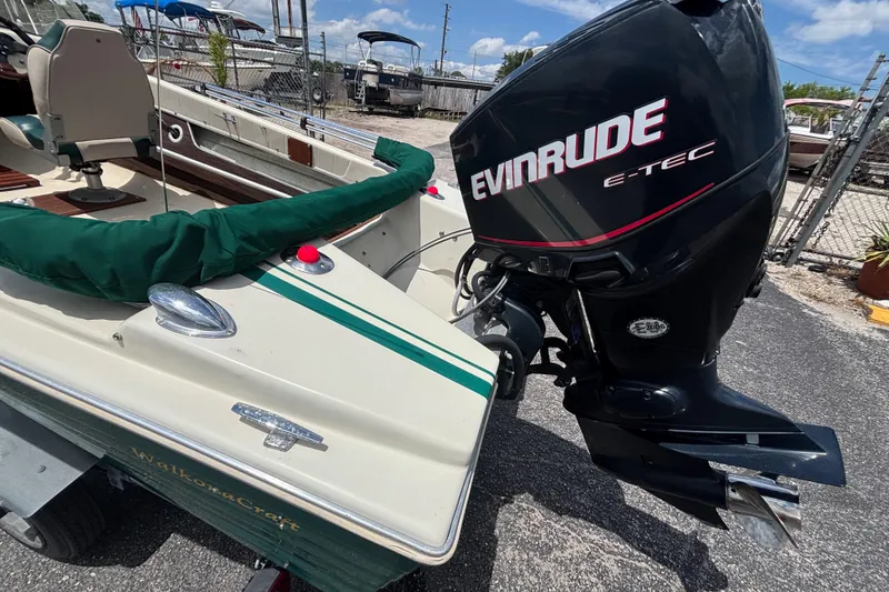 Slide: The Image of Vintage 1966 Mohawk 15 boat with Evinrude E-TEC outboard motor. - 20