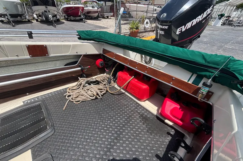 Slide: The Image of Interior of a 1966 Mohawk 15 boat with Evinrude motor and red fuel tanks. - 31