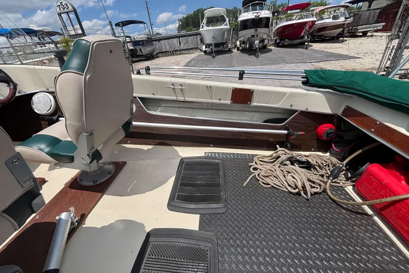 Slide: The Image of Interior of a 1966 Mohawk 15 boat with seating, ropes, and equipment. - 32
