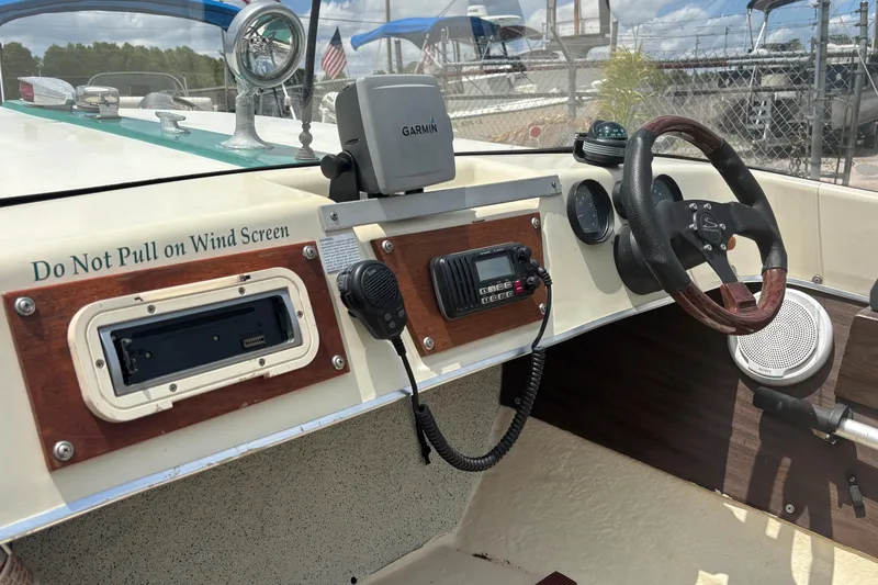 Slide: The Image of Interior of a 1966 Mohawk 15 boat with steering wheel and navigation equipment. - 33