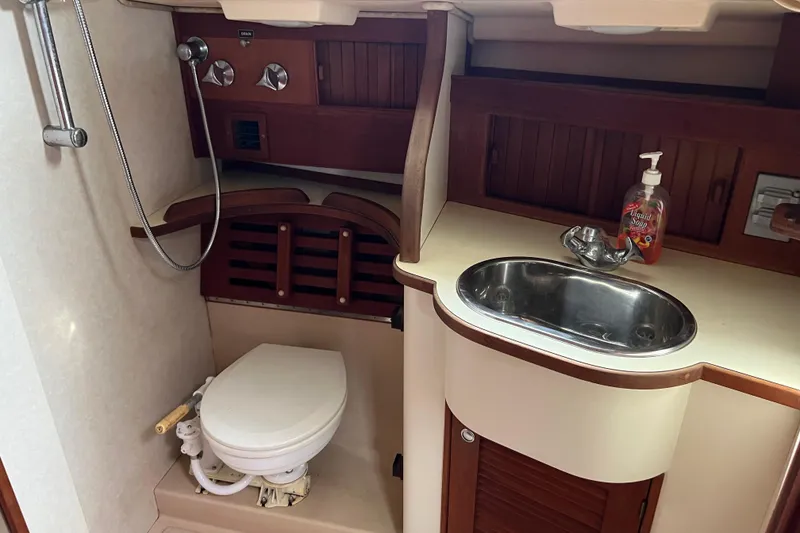 Slide: The Image of Head in 2002 Island Packet 380 sailboat with sink, toilet, and shower. - 18