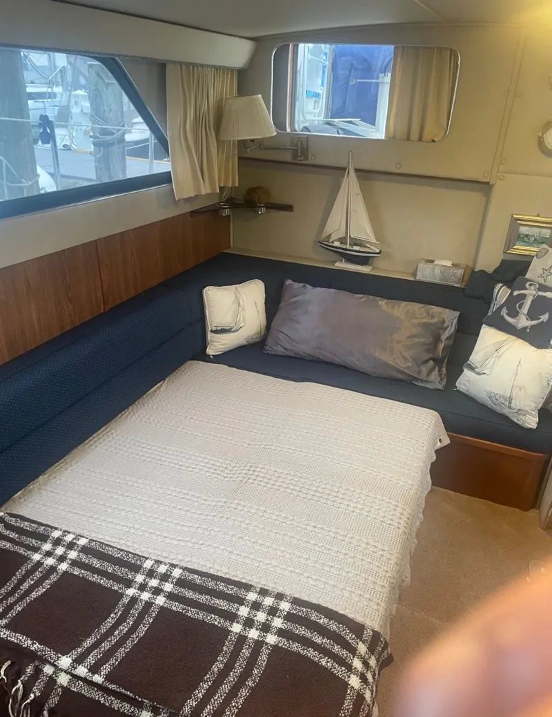 Slide: The Image of Interior of 1988 Chris-Craft 381 Catalina yacht with cozy bed. - 12