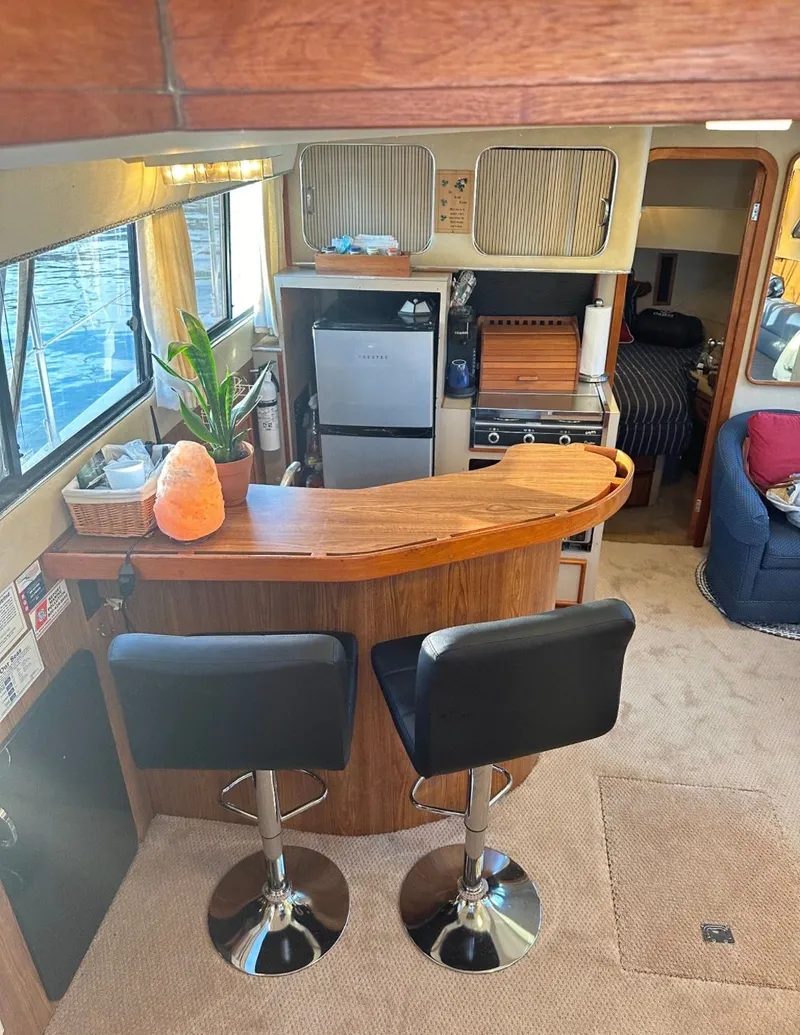 Slide: The Image of Interior of a 1988 Chris-Craft 381 Catalina yacht with bar and kitchen. - 14
