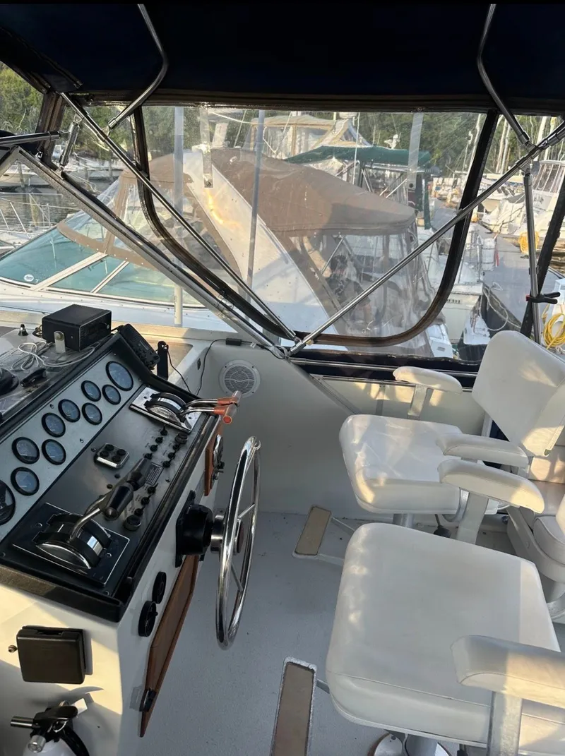 Slide: The Image of Interior view of 1988 Chris-Craft 381 Catalina cockpit with controls. - 2