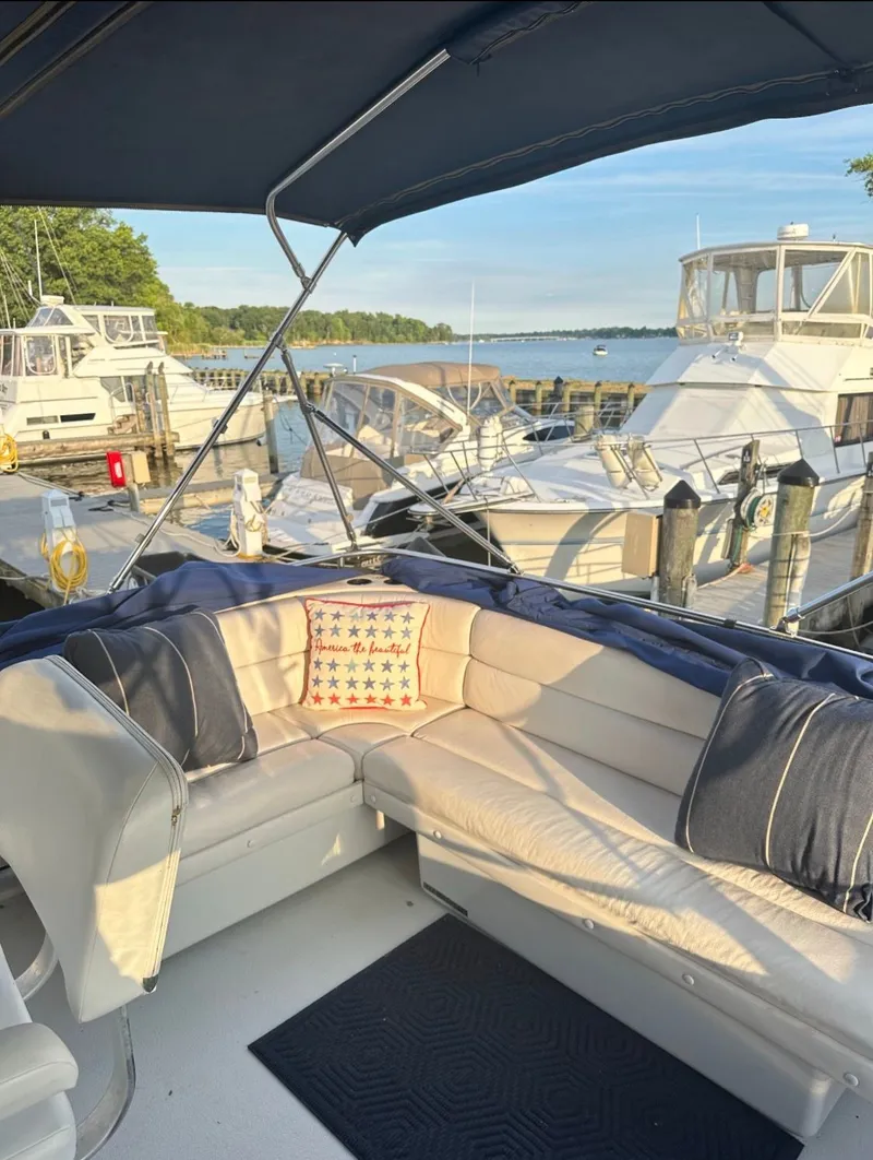 Slide: The Image of 1988 Chris-Craft 381 Catalina with cozy seating area at the dock. - 6