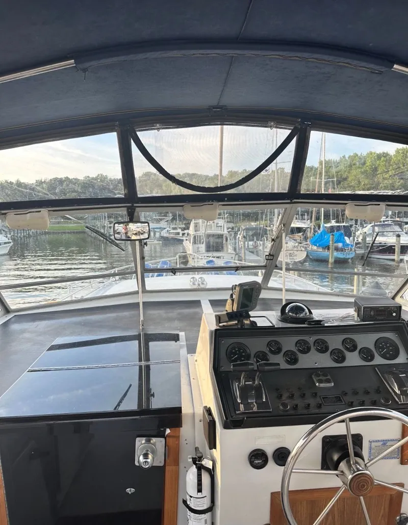 Slide: The Image of Interior view of 1988 Chris-Craft 381 Catalina cockpit in harbor. - 7