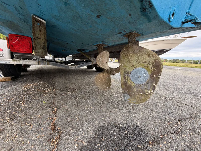 Slide: The Image of Underside of a 2000 Baha Cruisers 272 Fisherman boat on a trailer. - 13