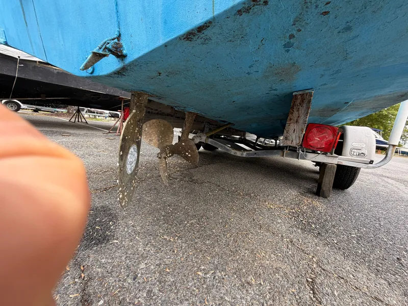 Slide: The Image of Underside of a 2000 Baha Cruisers 272 Fisherman boat on trailer. - 14