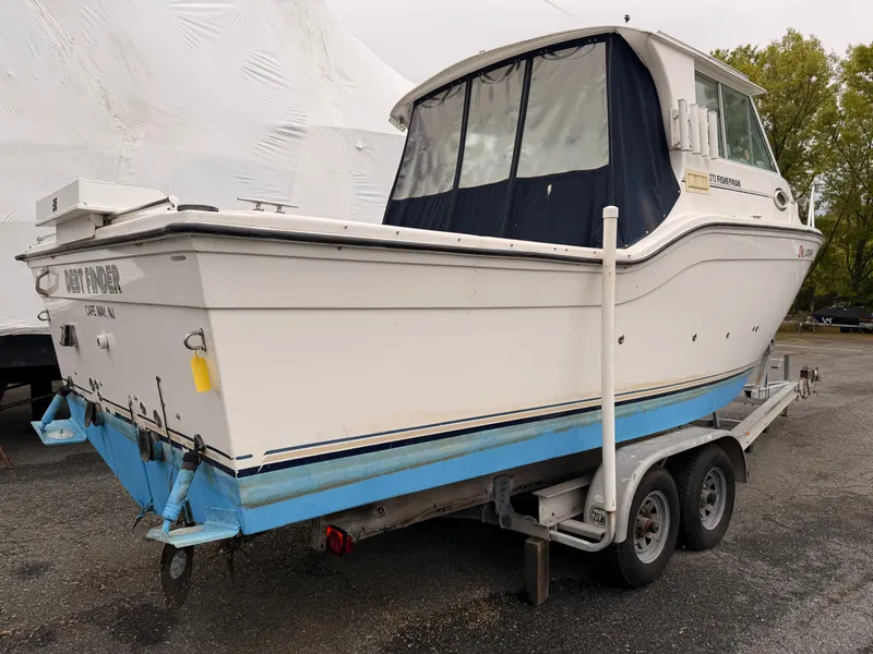 Slide: The Image of 2000 Baha Cruisers 272 Fisherman on trailer, white with blue bottom. - 2